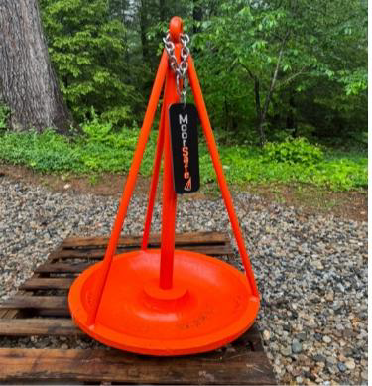 A MoorSafe anchor with its tag attached, showing the orange bowl and the three-bar cone
